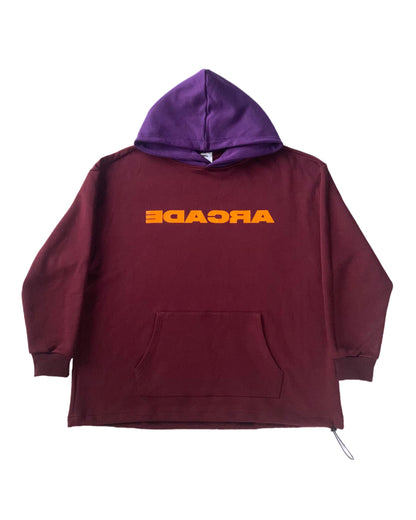 Reverse Arcade Hoodie 2-Tone Features: Purple Hood Burgundy Body Screen printed Backwards “Arcade” Graphic on chest Heavyweight 420 GSM 100% French Terry Cotton Oversized loose fit Semi-cropped w/ drop shoulders Adjustable cord lock on waist